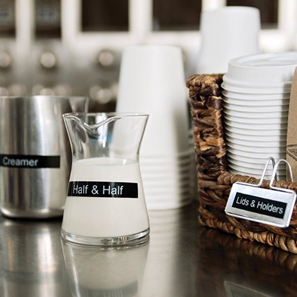 A labeled coffee station.