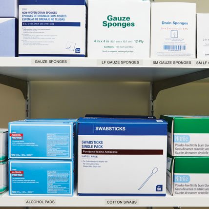 Labeled shelves of medical supplies.