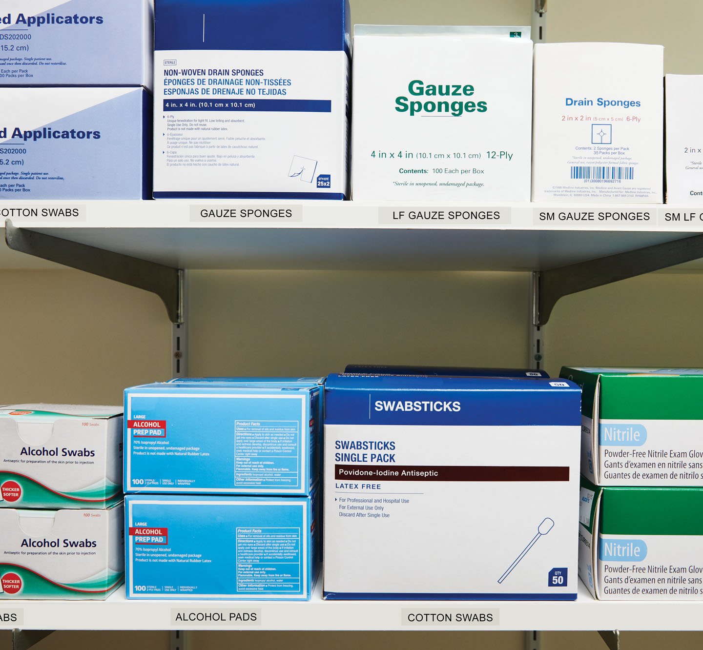 Labeled shelves of medical supplies.