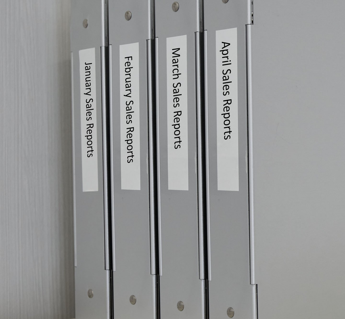 Row of labeled binders.