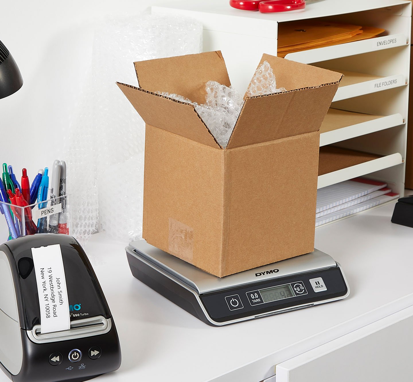 A package being weighed on a scale.