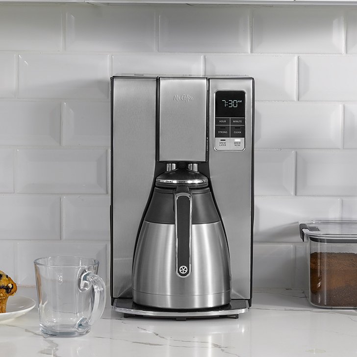 silver coffee maker with thermal carafe on counter