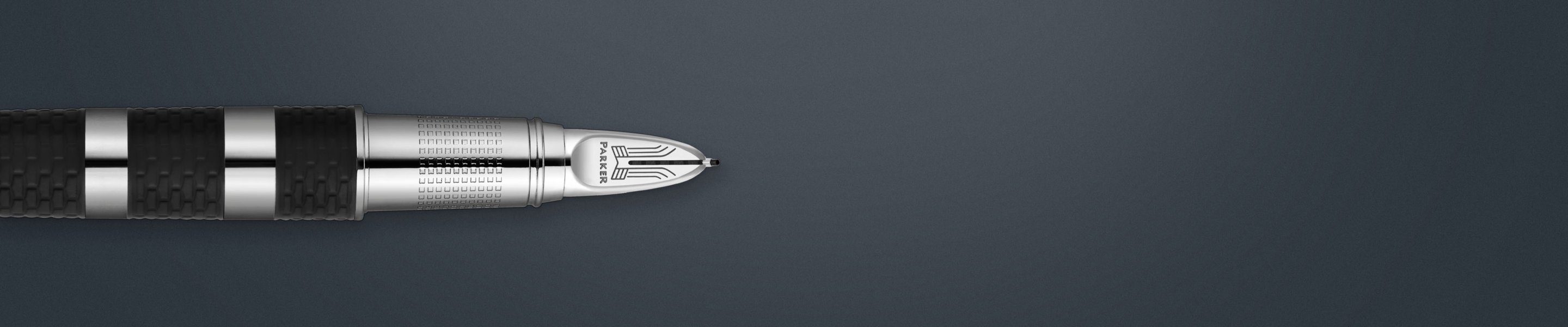 Closeup of a Parker Fifth fountain pen nib and barrel with chrome trim.