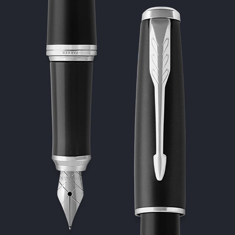 Closeup of an Urban muted black chrome fountain pen nib and pen cap.