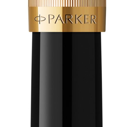 Closeup of a Parker 51 barrel and pen cap with gold trim showcasing an engraved Parker logo.