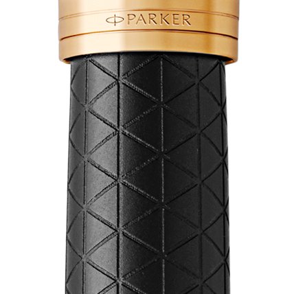 Closeup of a Parker 51 pen barrel and pen cap with gold trim showcasing an engraved Parker logo.