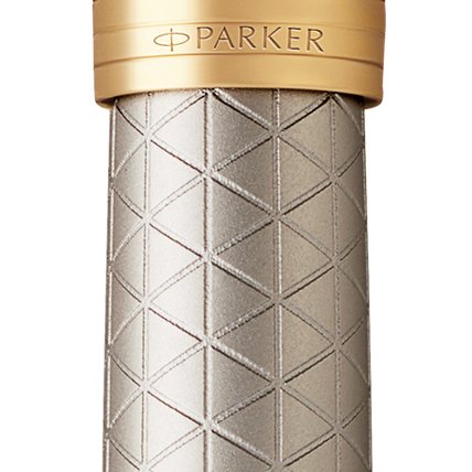 Closeup of a Parker 51 pen barrel and pen cap with gold trim showcasing an engraved Parker logo.