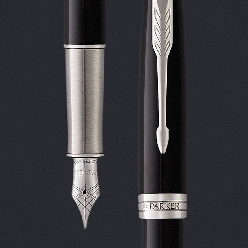 Closeup of a Sonnet fountain pen nib and pen cap with arrow clip.