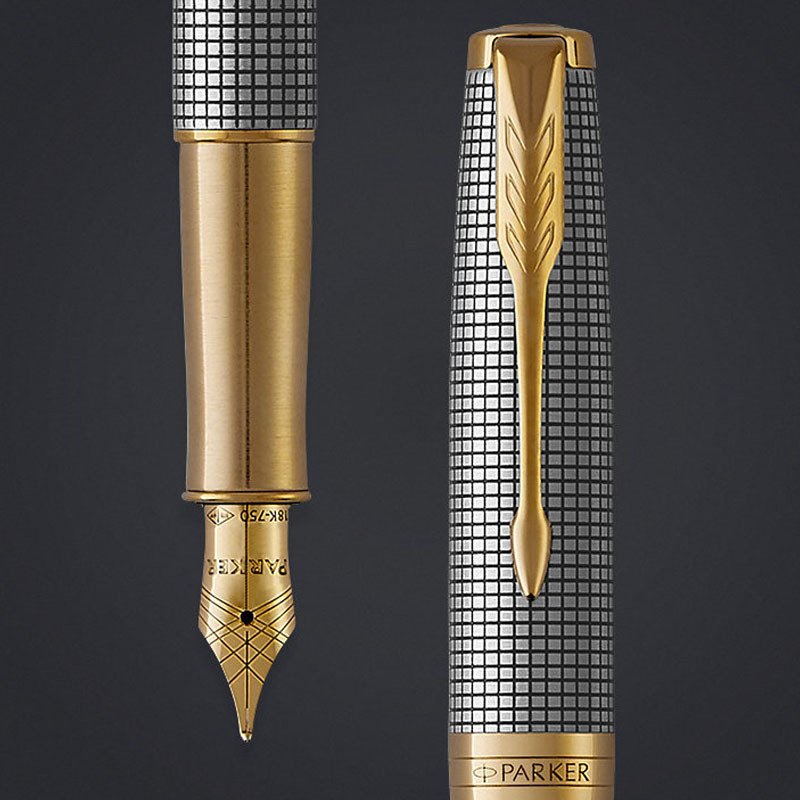 Closeup of a Sonnet fountain pen nib and pen cap with gold trim.