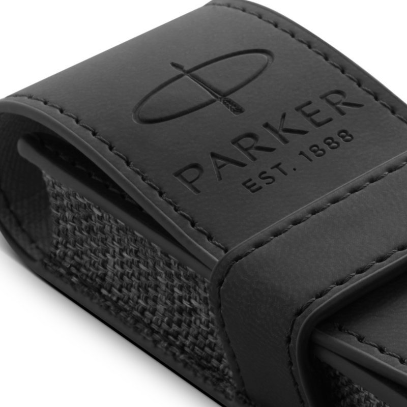 Closeup of the embossed Parker logo on a black pen pouch.