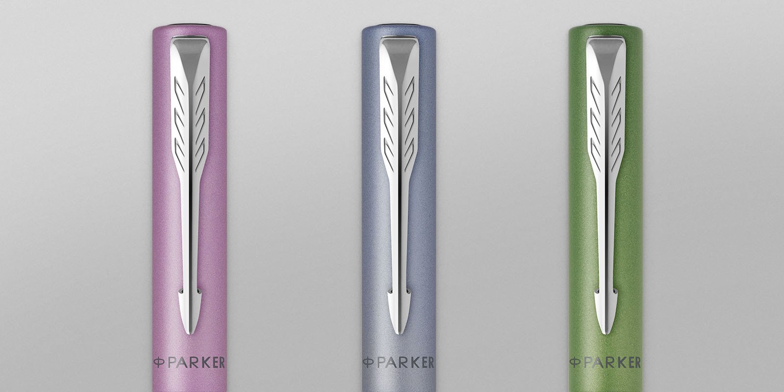 three ball point pen caps in different colors
