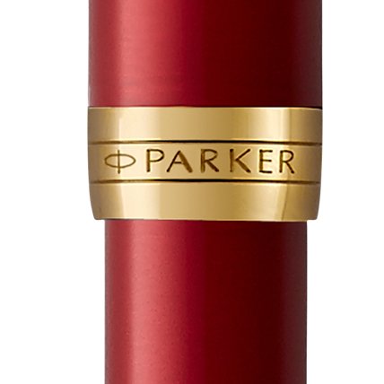 Closeup of a Sonnet barrel and pen cap with gold trim showcasing an engraved Parker logo.