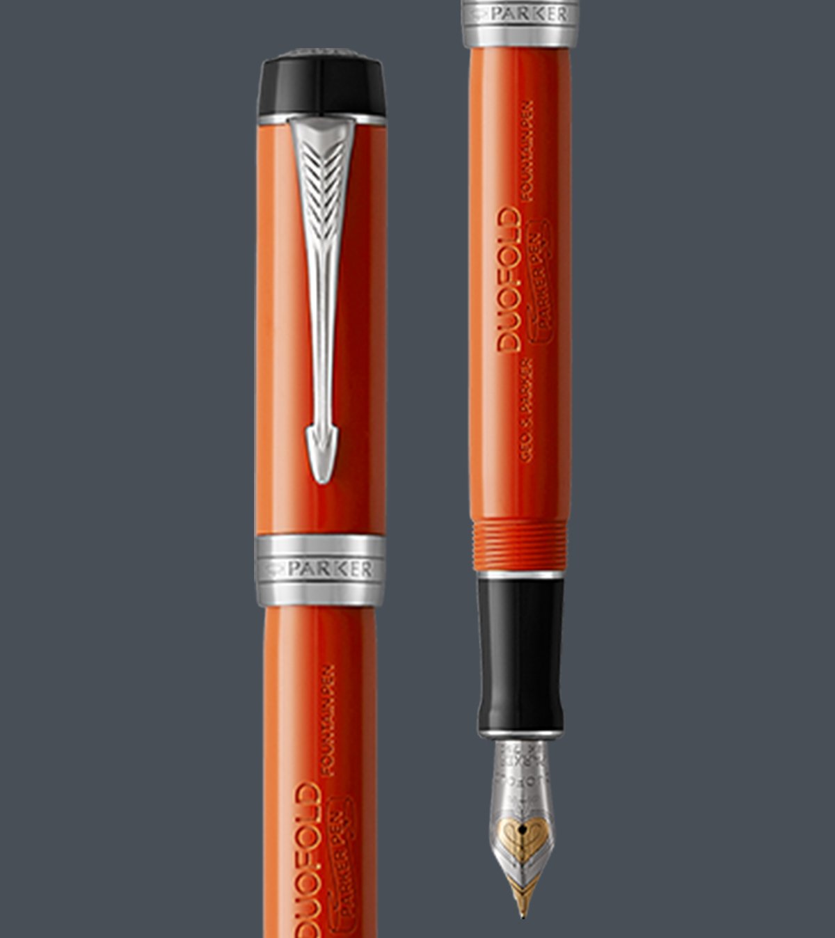 Two upright Duofold fountain pens with chrome trim.