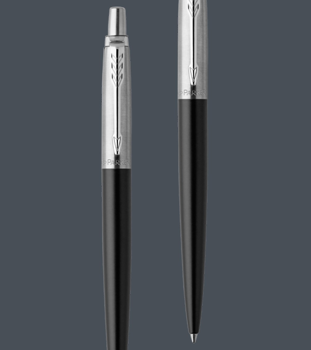 Two upright Jotter ballpoint pens with chrome trim.