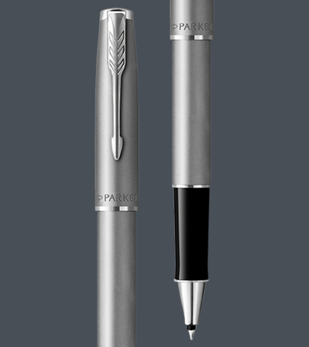 Two upright Sonnet rollerball pens with chrome trim.