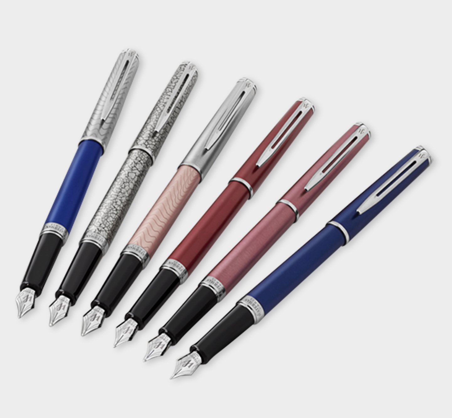 Six Hemisphere fountain pens with chrome trim lined up in a curved formation.