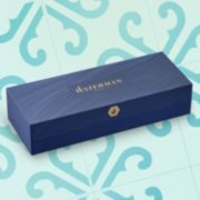A closed gift box over a colorful background. image number 6