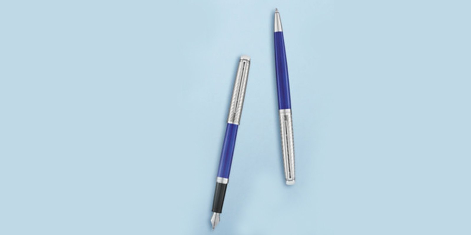 A Hemisphere fountain pen and Hemisphere ballpoint pen laid on a surface.