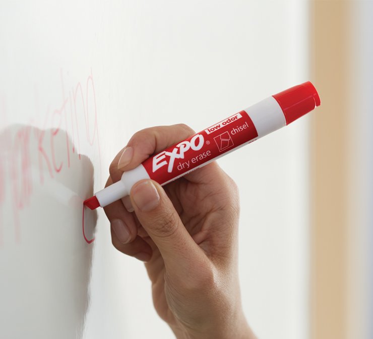 Red Expo marker writing on whiteboard