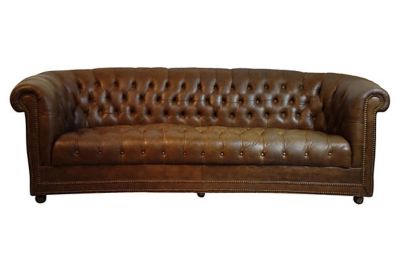 A tufted leather Chesterfield sofa.