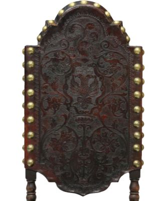 Tooled leather typical of Renaissance-era Spanish chairs.