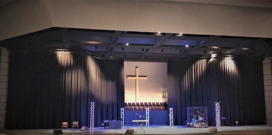Heights Church Stage with black curtain hung with Chainrail motorized curtain track