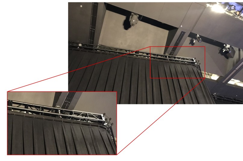 Chainrail motorized curtain track hung from truss