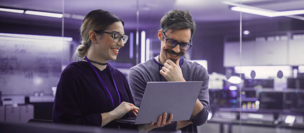 Researchers reviewing biological data from combination of AI and genetic technology using Solidigm high-capacity SSDs.