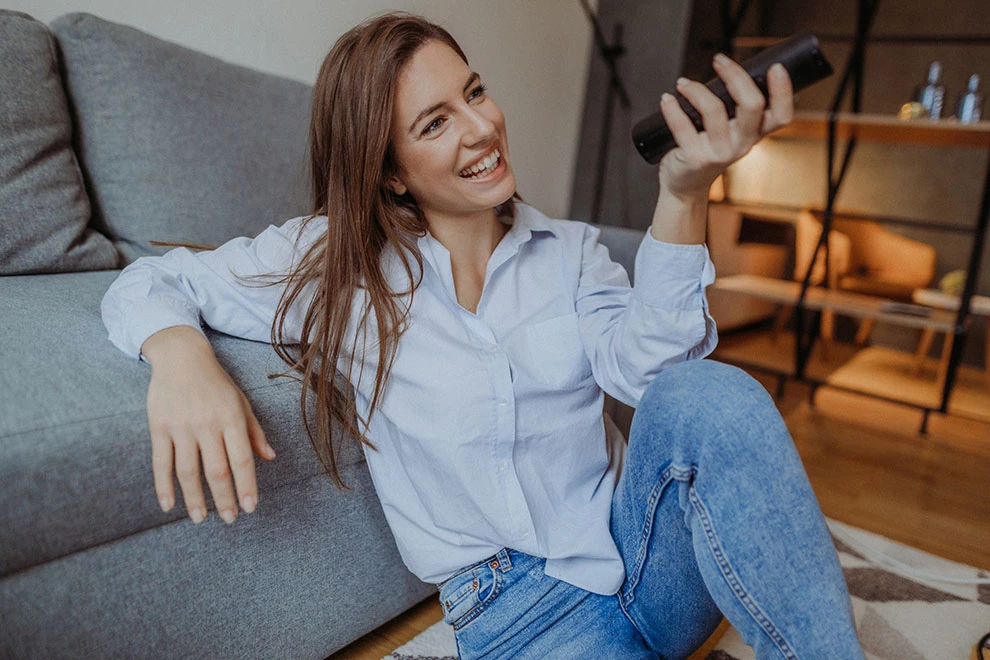 Young woman watching TV