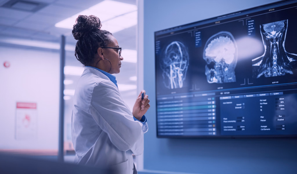 Medical professional examining x-ray enhanced by AI
