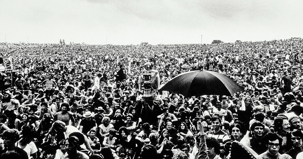 Woodstock music festival comparison to inference with RAG in AI SSD offloading.