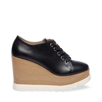 Offering height and stability, UPSCALE pairs a dramatic stacked platform wedge with a lux leather upper and sporty lacing. Treaded rubber trims the style's sole, creating a color-blocked look while ensuring a slip-free step. Leather upper material Fabric lining Man-made sole 4 inch heel height 1.25 inch platform
