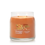 burning farm fresh peach signature medium jar candle image number 1