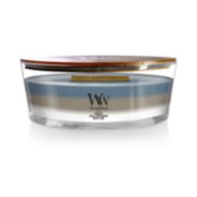 woodwick unchartered waters ellipse trilogy candle featuring layered scents of tempest, sand & driftwood, and white teak
