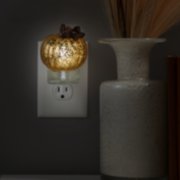 crackle pumpkin scentplug diffuser plugged into outlet image number 2