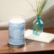 life's a breeze signature large tumbler candle on table in living room image number 2