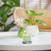 pineapple cilantro signature small tumbler candle on table image number 3