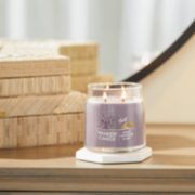 dried lavender and oak signature medium jar candle on table image number 3