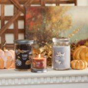 cozy cabin escape signature large tumbler candle, spiced pumpkin signature small tumbler candle, and smoked vanilla and cashmere signature large jar candle on mantle image number 4