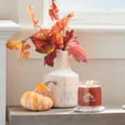 apple pumpkin signature medium jar candle on table image number 4