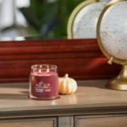 cranberry chutney signature medium jar candle on table image number 4