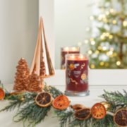 holiday zest signature large tumbler candle on mantle image number 4