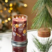 holiday zest signature large tumbler candle on table image number 3