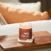 cinnamon stick signature medium jar candle on table image number 4