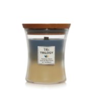 tropical oasis sand and driftwood at the beach medium hourglass trilogy candle image number 0