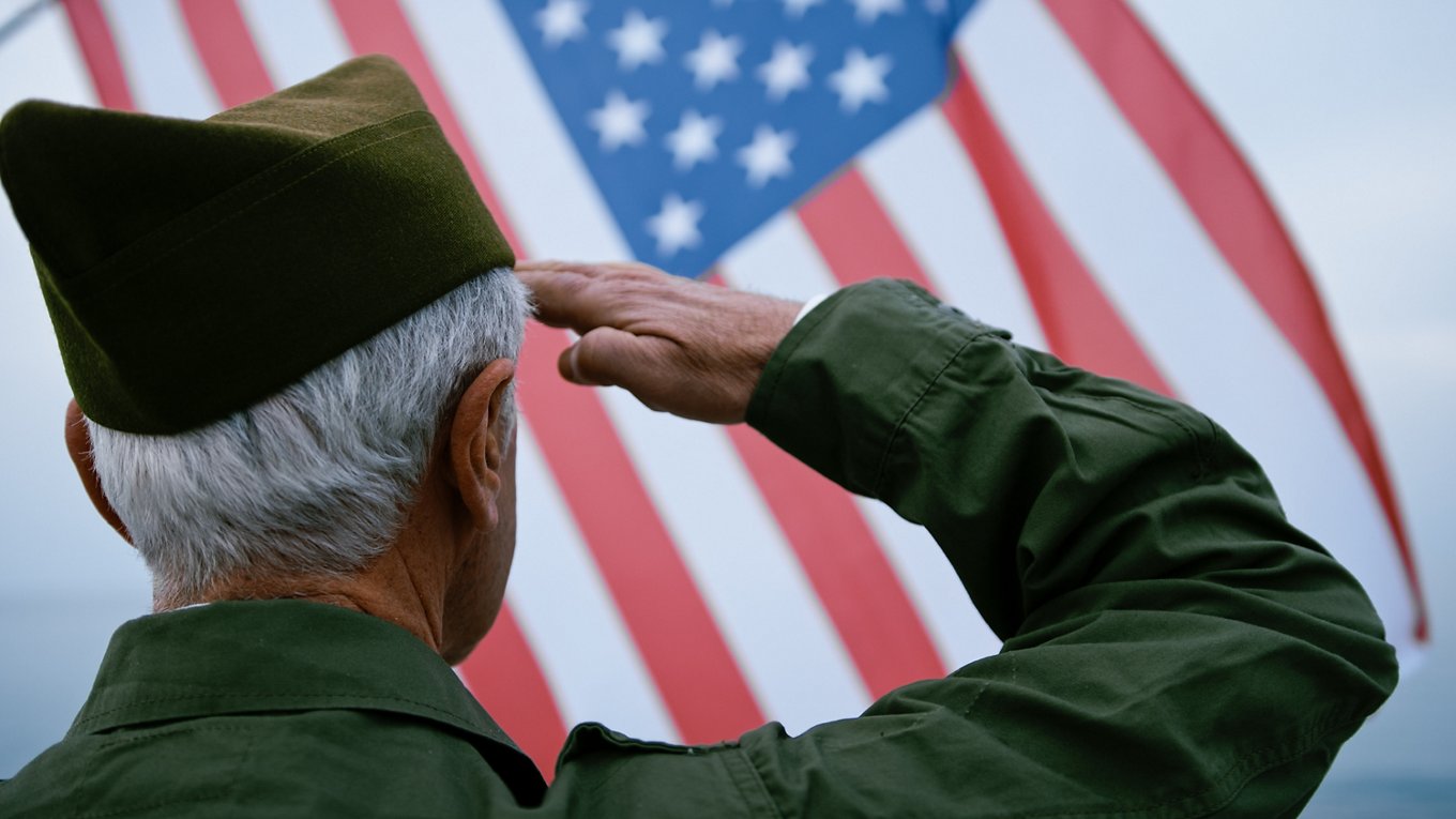 Veteran Saluting American Flag Outside