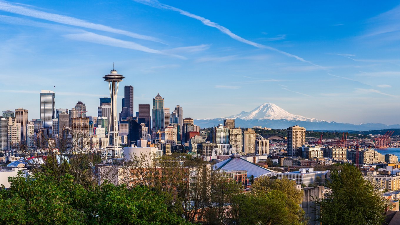 Panorama view of Seattle downtown skyline and Mt. Rainier, Washington.