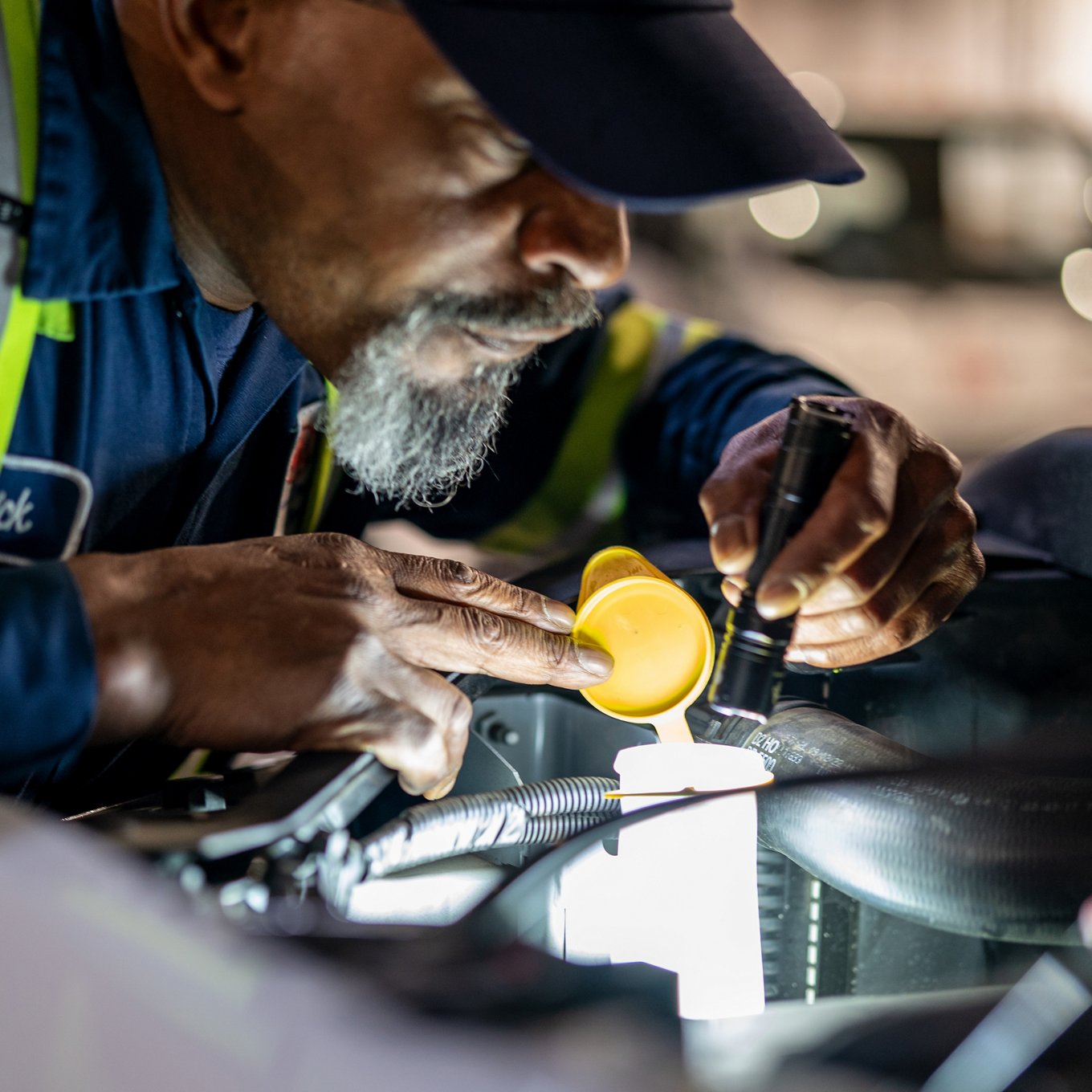 aaa service agent working on engine