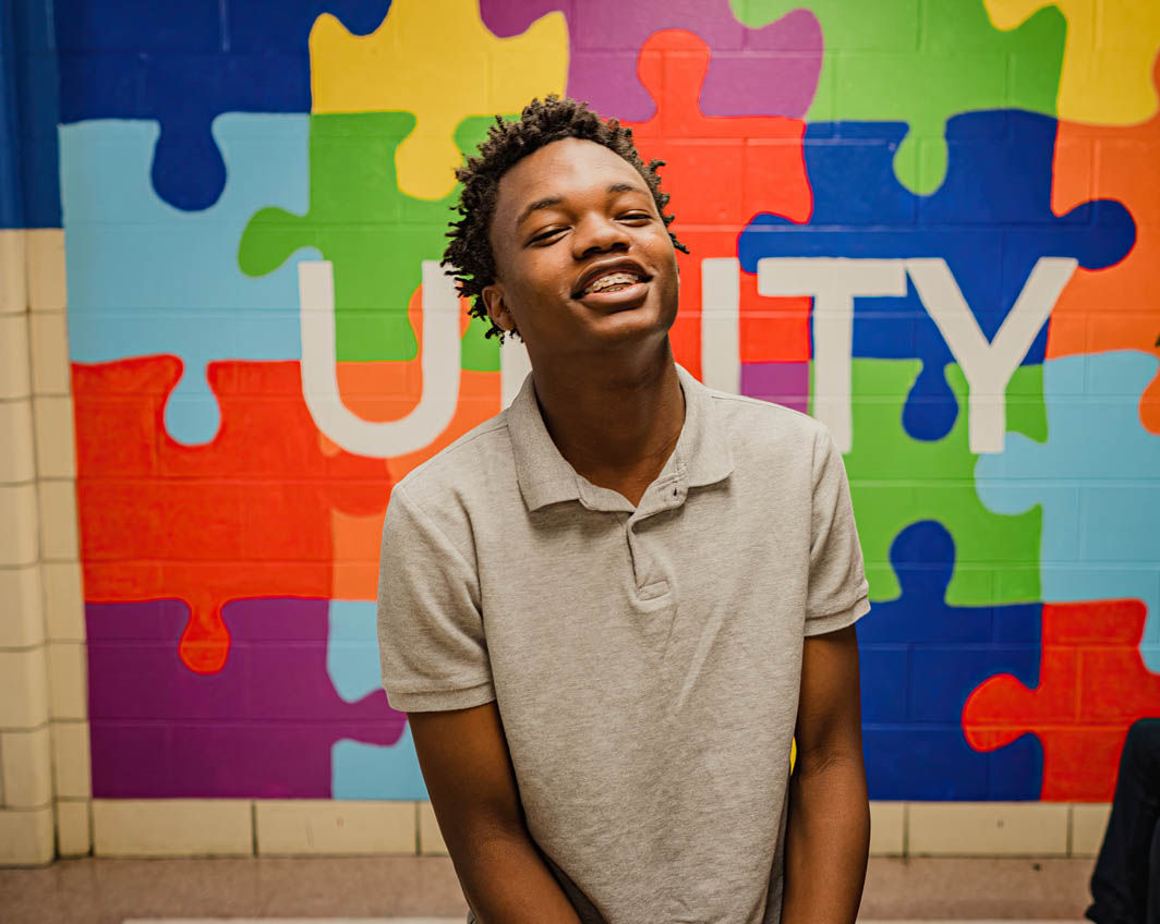 boy laughing unity mural
