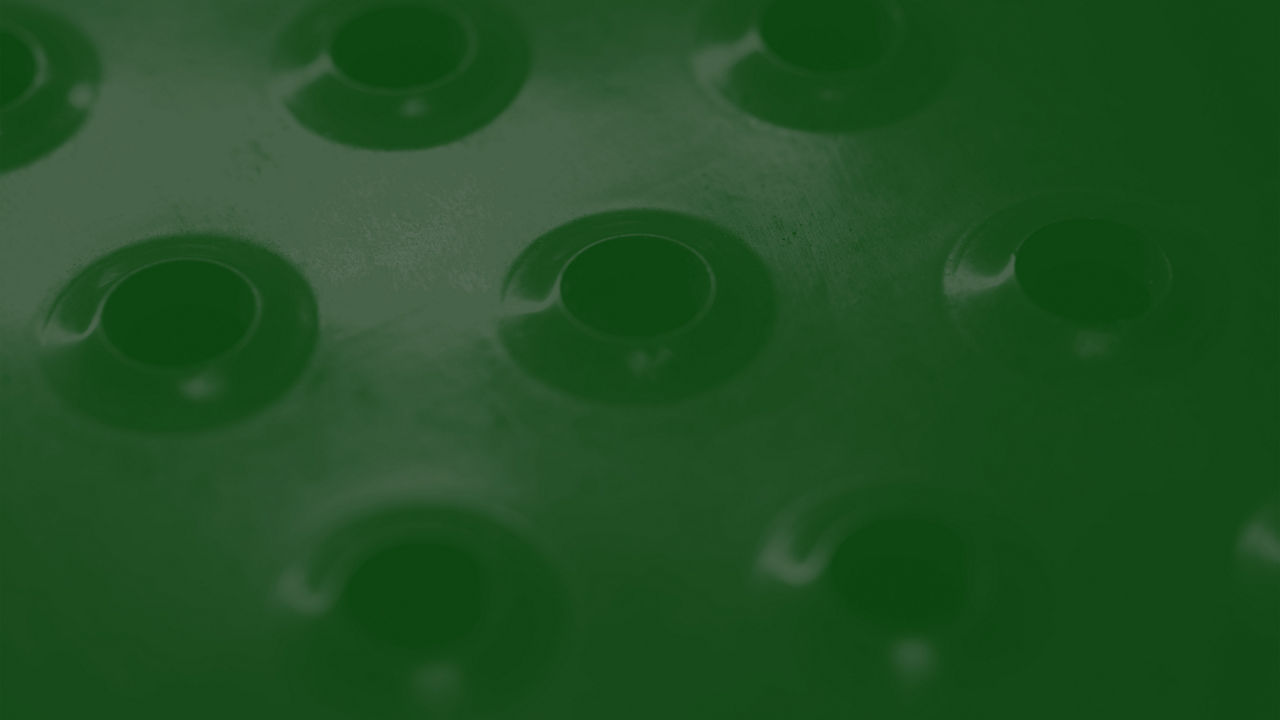 The faint outline of a filter on a dark green background